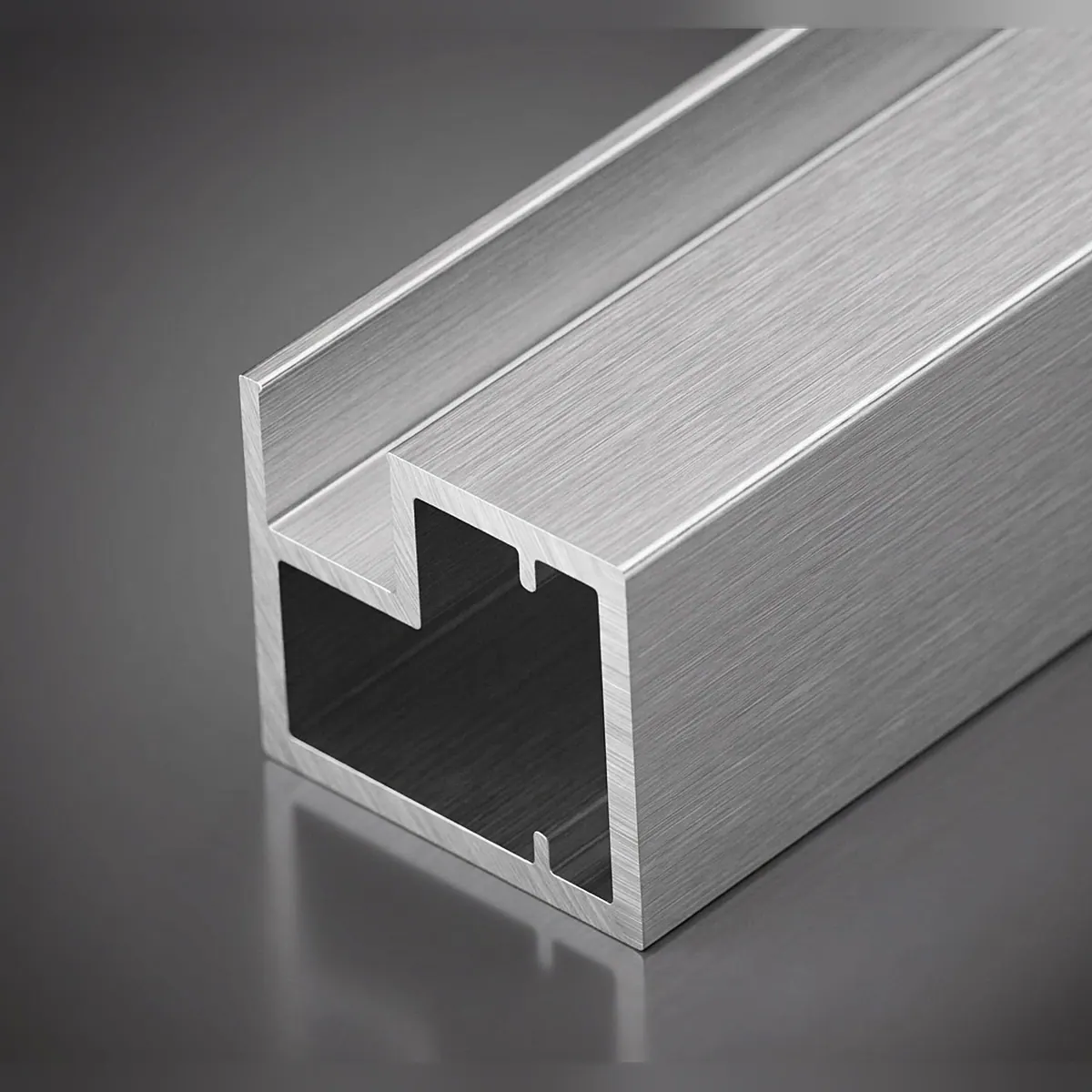 20-20 aluminium insert profile in brushed silver, showing the hollow square section and glass channel
