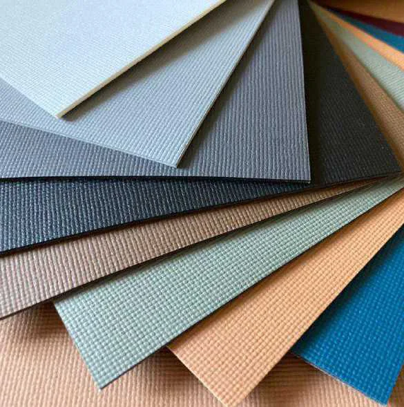 Fan of textured anti-slip sheets in light grey, grey, slate, tan, sage green and blue