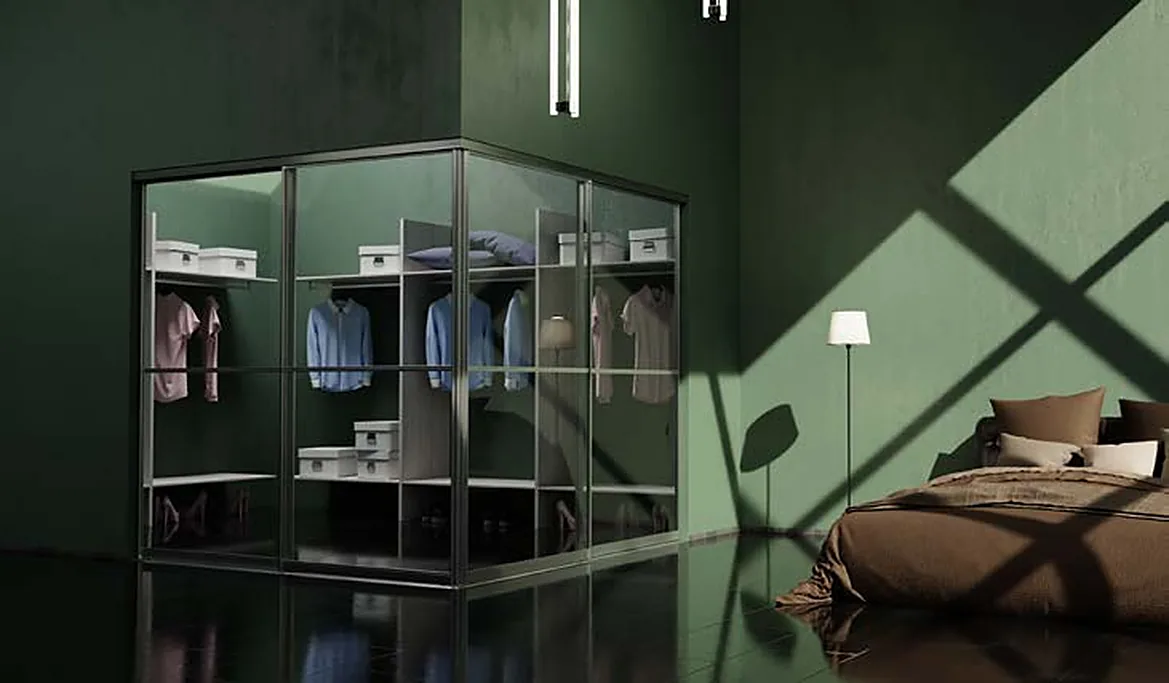 Corner wardrobe with aluminium-framed glass doors in a green bedroom Corner wardrobe with aluminium-framed glass doors in a green bedroom