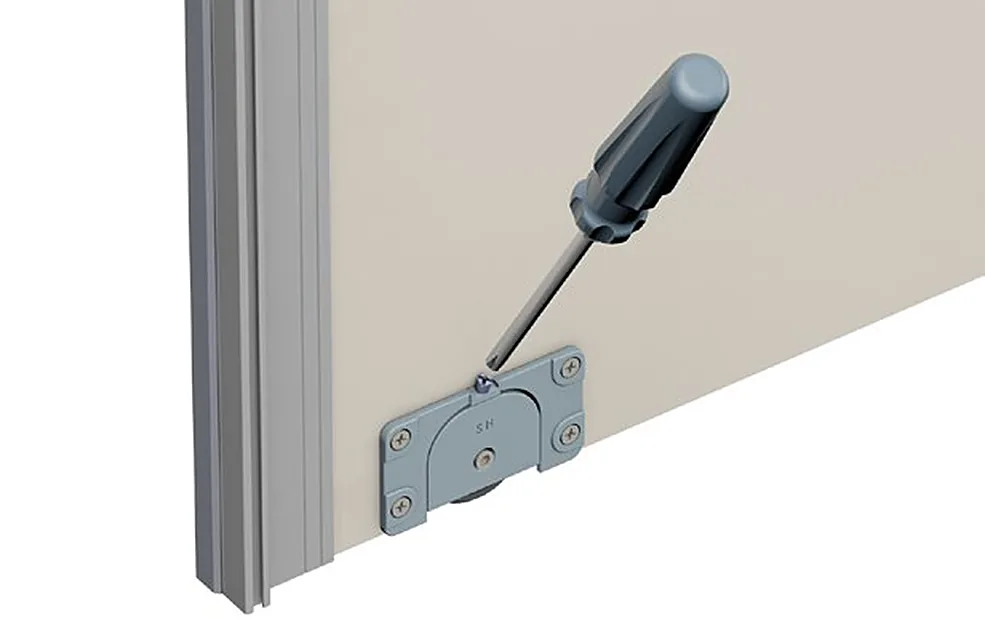 Adjusting the height of a Bridge 600 sliding door with a screwdriver at the lower roller Adjusting the height of a Bridge 600 sliding door with a screwdriver at the lower roller