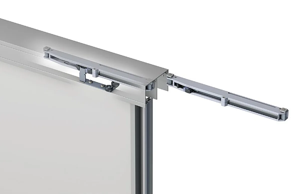 Soft-close damper fitted in the upper rail of a Bridge 600 door Soft-close damper fitted in the upper rail of a Bridge 600 door