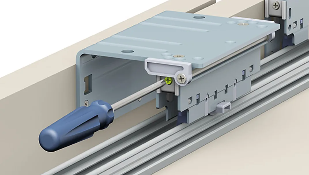 Adjusting an Evolution upper carriage on its rail with a screwdriver
