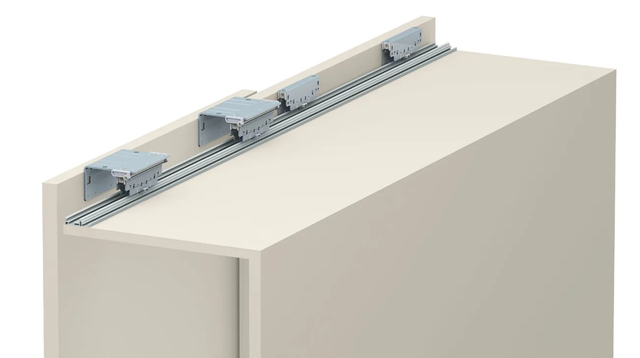 Evolution upper rail with several carriages fitted on top of a wardrobe carcass