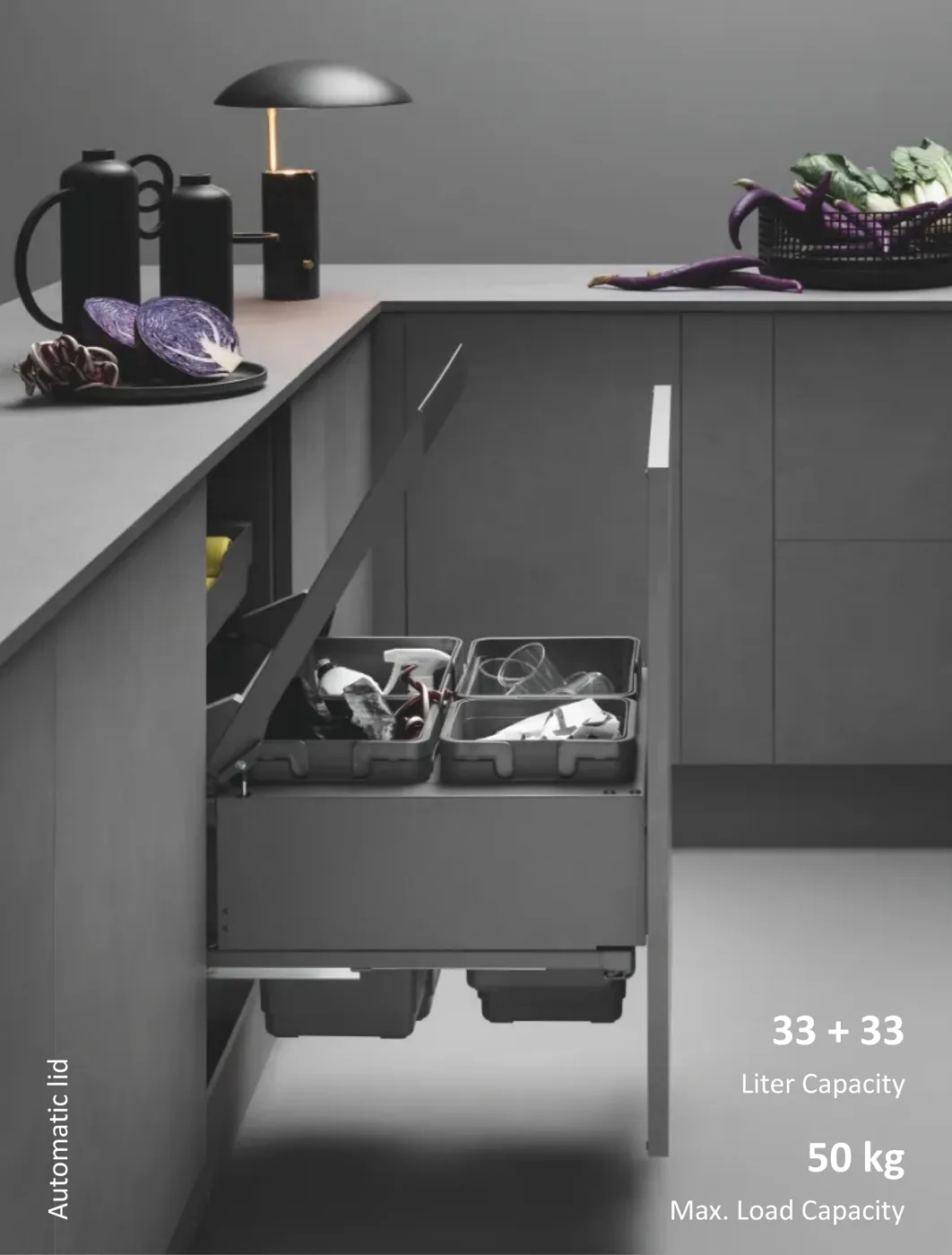 Mirano Globe 2.0 pull-out waste bin system with automatic lid and segregated bins installed in a matte grey modular kitchen