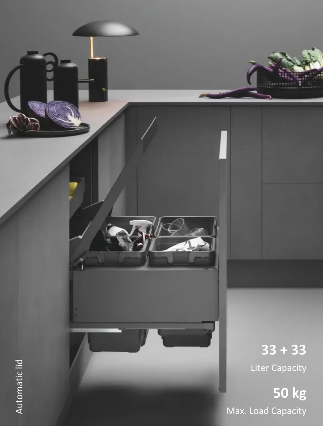 Mirano Globe 2 pull-out waste sorting system with automatic lid, 33 plus 33 litre bins and 50 kg load capacity in a dark modular kitchen