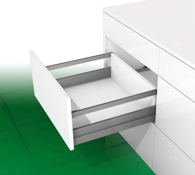 Kitchen drawer with a rectangular railing above the metal side panel, open in a white modular base cabinet