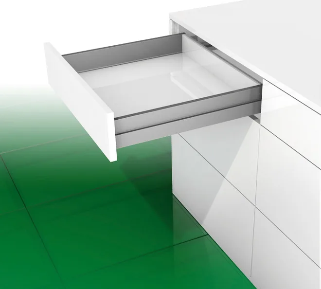 Shallow inset kitchen drawer with slim transparent-look sides, open in a flush white modular kitchen