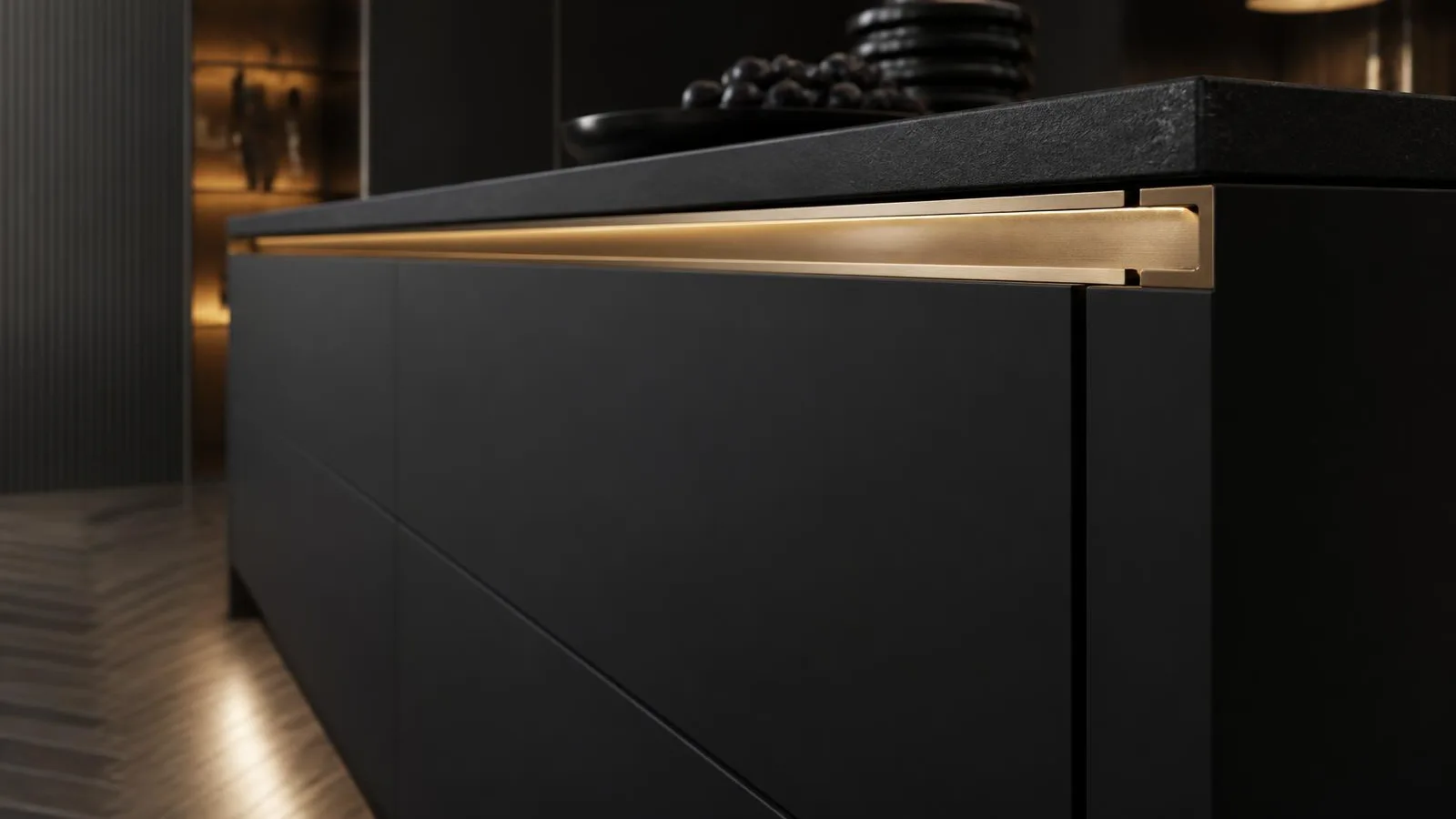 Modular kitchen handles and knobs — 2026 design trends guide Matte black handleless kitchen island with a continuous champagne gold aluminium profile handle
