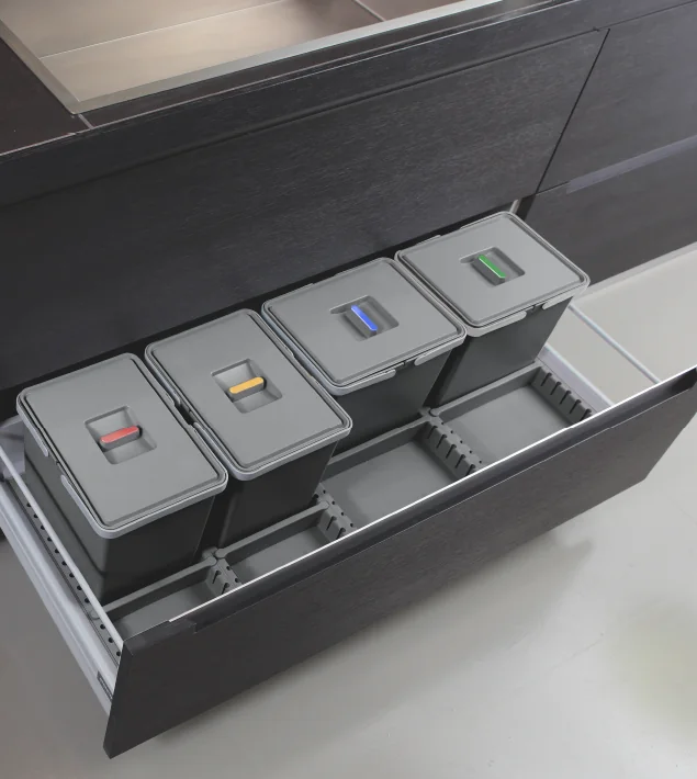 Metropolis under-drawer waste bin system Metropolis four-bin waste system with coloured lid handles installed in a wide kitchen drawer