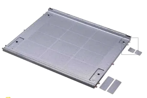 Ribbed aluminium-look sink base panel with four separate small cover plates beside it