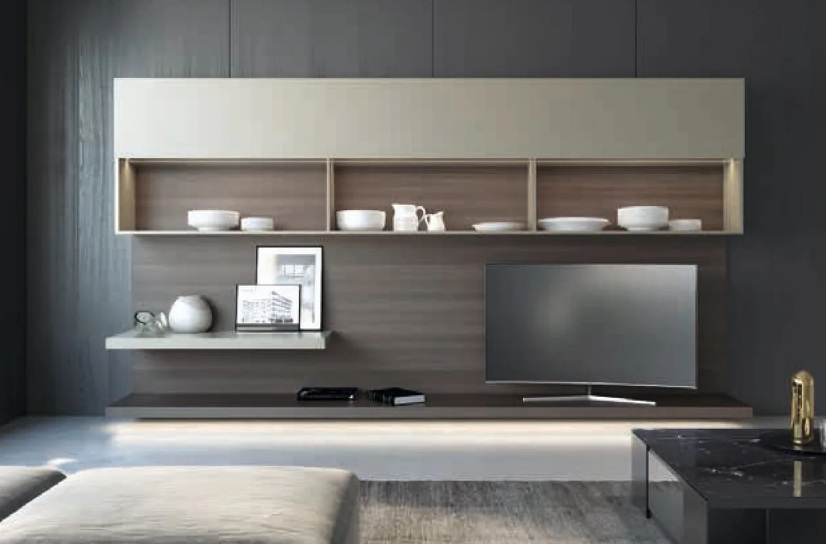 The same living-room wall unit with the beige front panel lifted above a row of open shelves holding white crockery