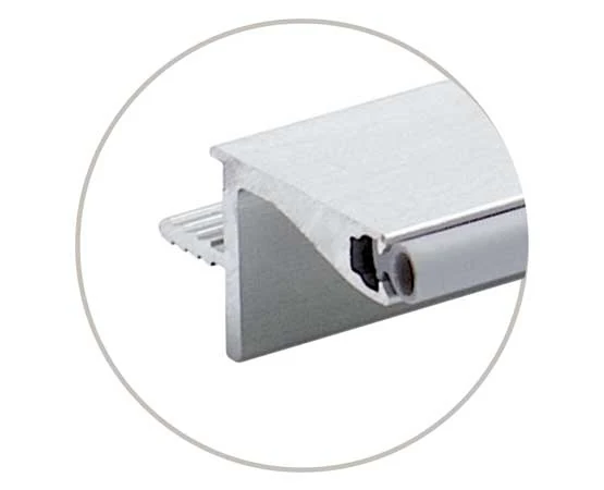 Wall gola profile section Close-up of an aluminium wall gola profile section with a flange, rear lip and sealing strip